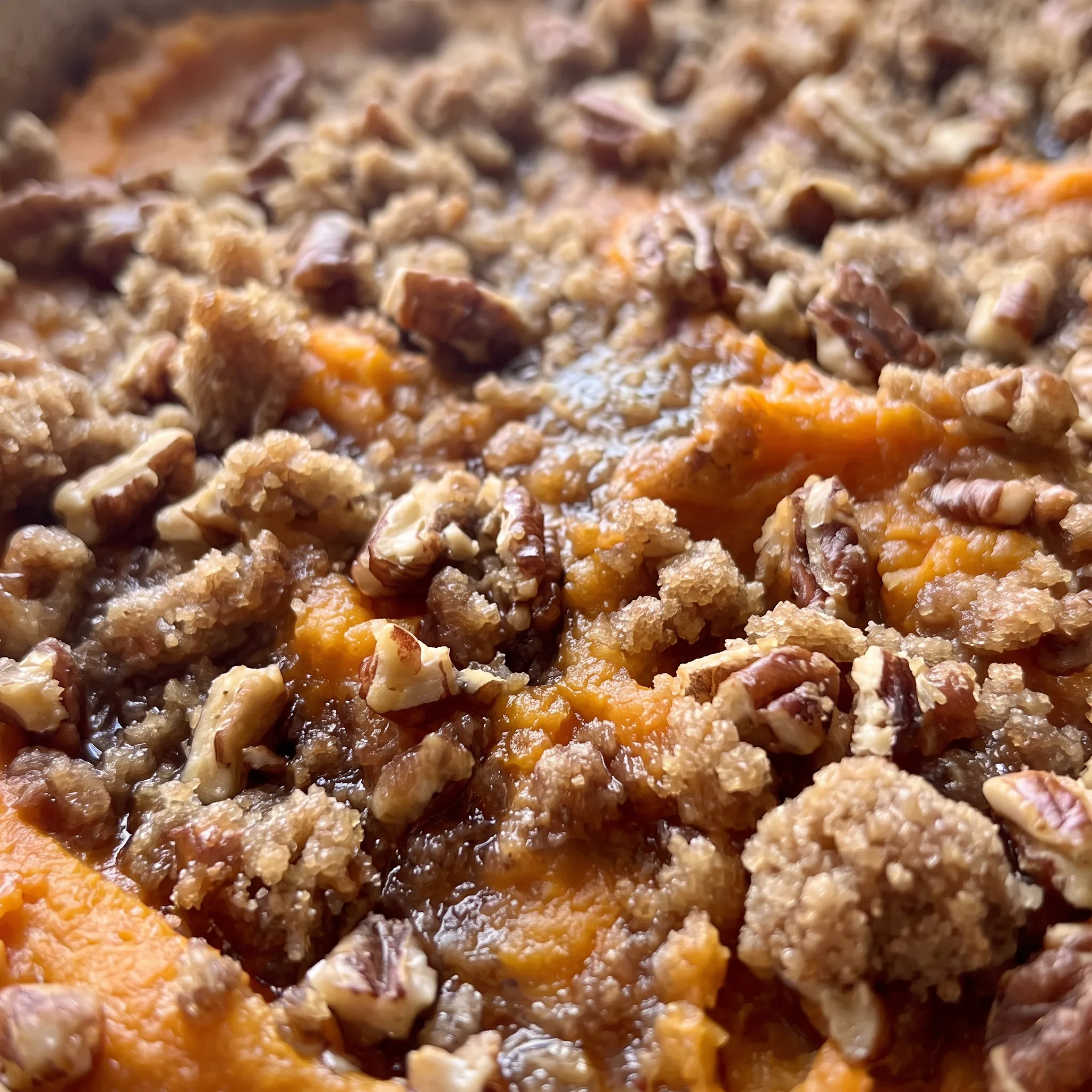 Golden marshmallows and crunchy pecan pieces over a smooth orange sweet potato base.